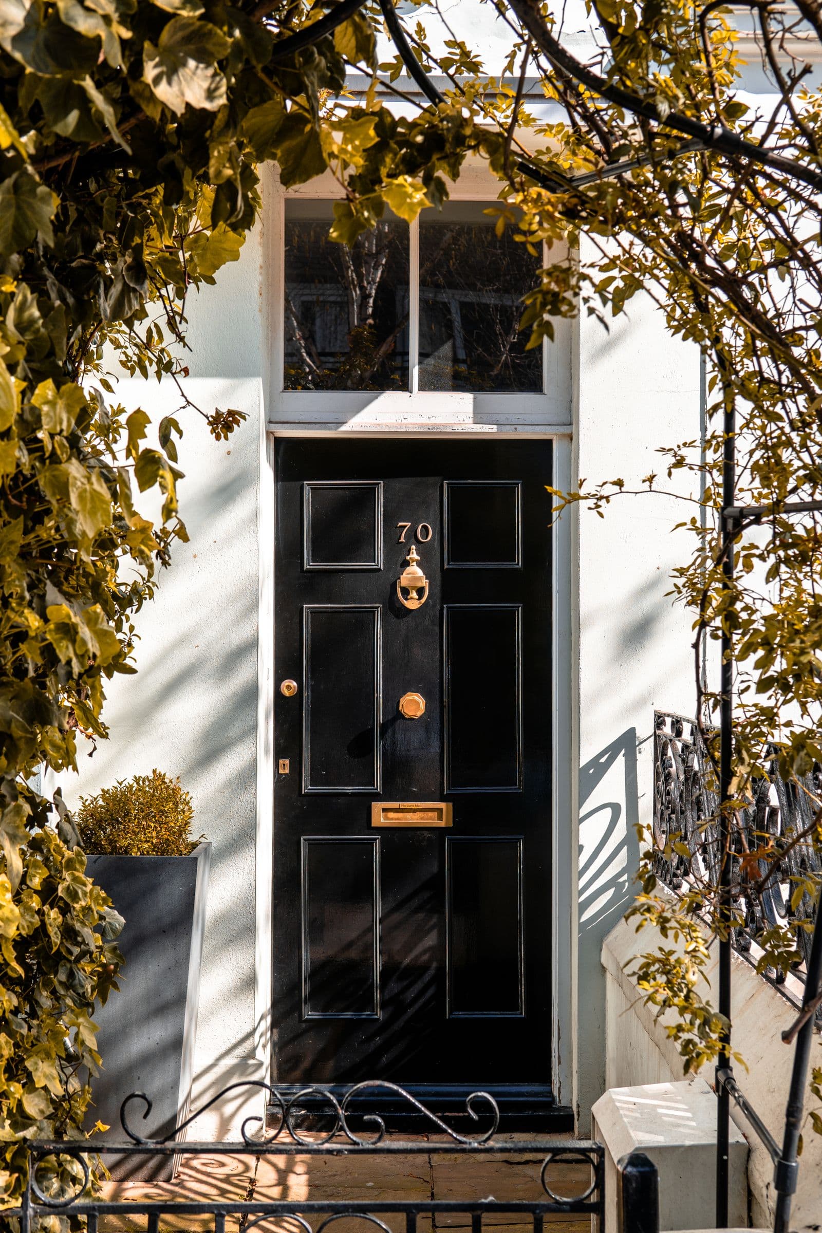 A closed front door on a quiet house