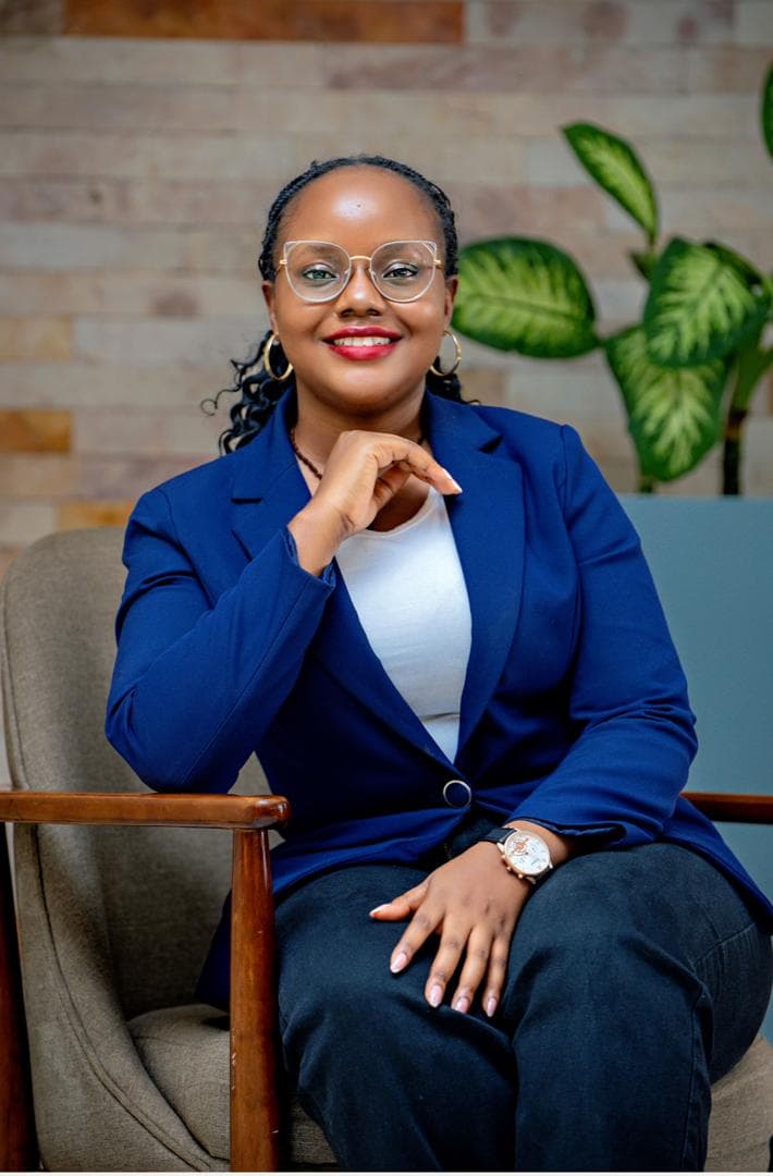 Maryheals, psychologist, seated in a professional portrait