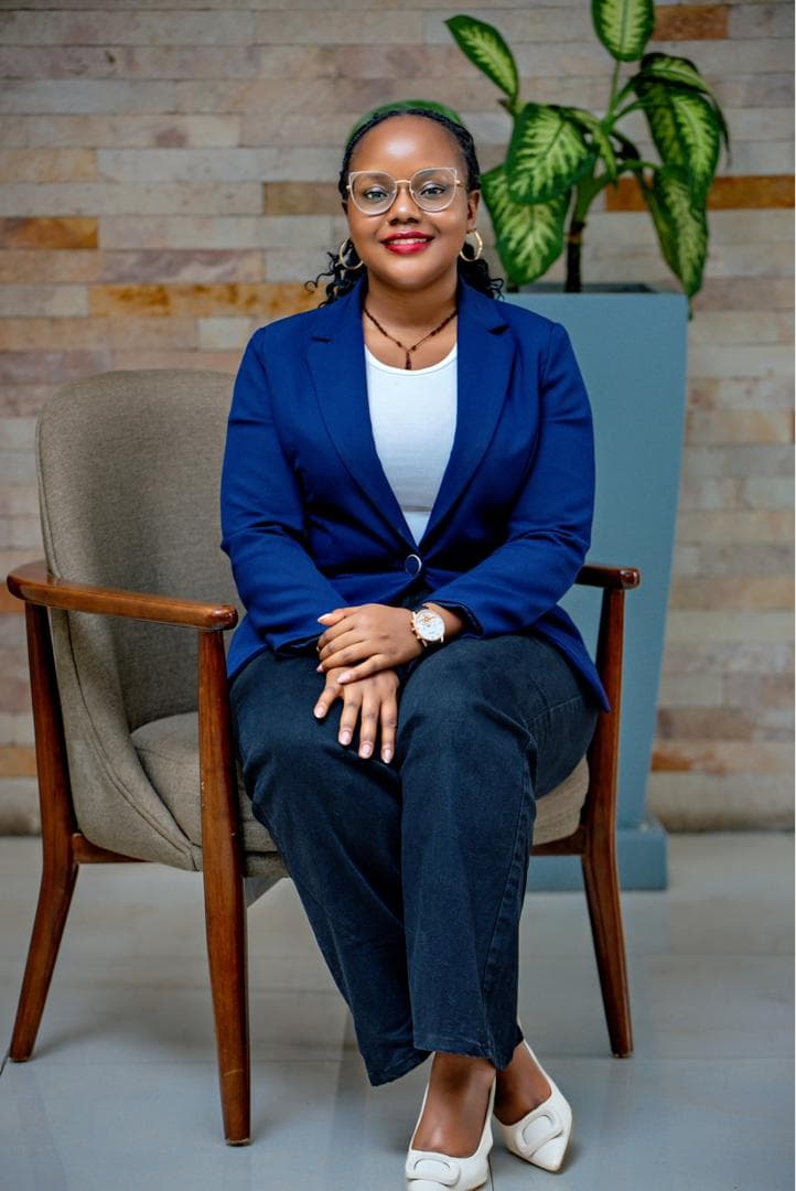 Maryheals, psychologist, seated in a full-length professional portrait